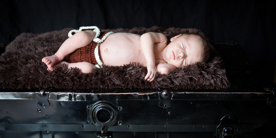 Newborn on hope chest