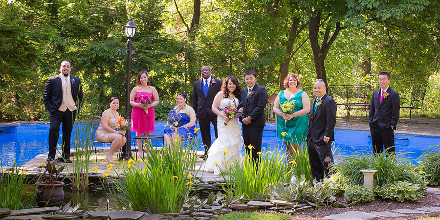Wedding photo by pool at stirling mansion reading pa