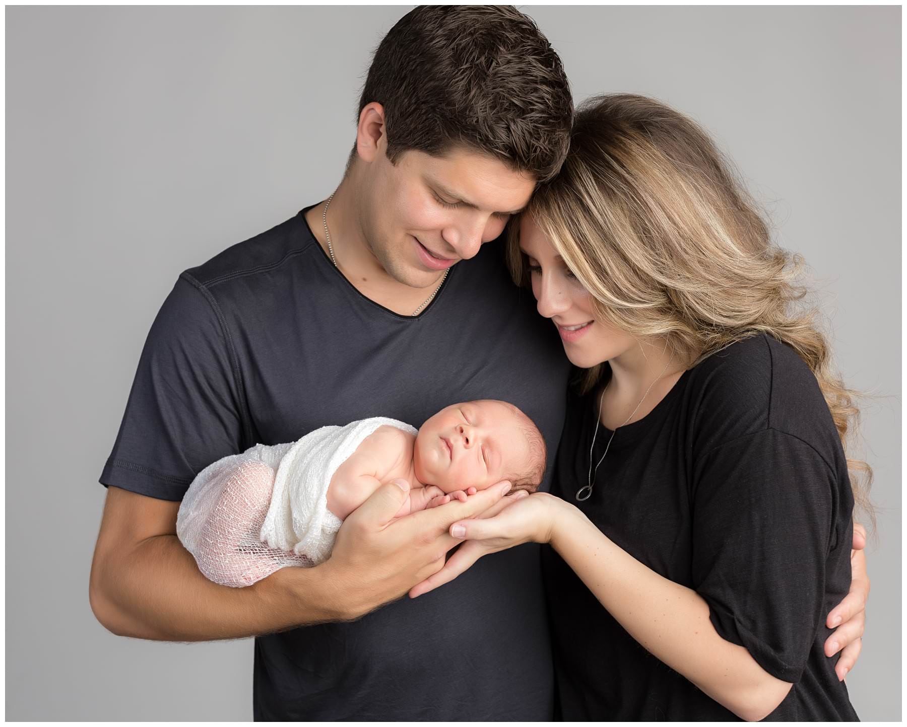 Newborn with family portrait