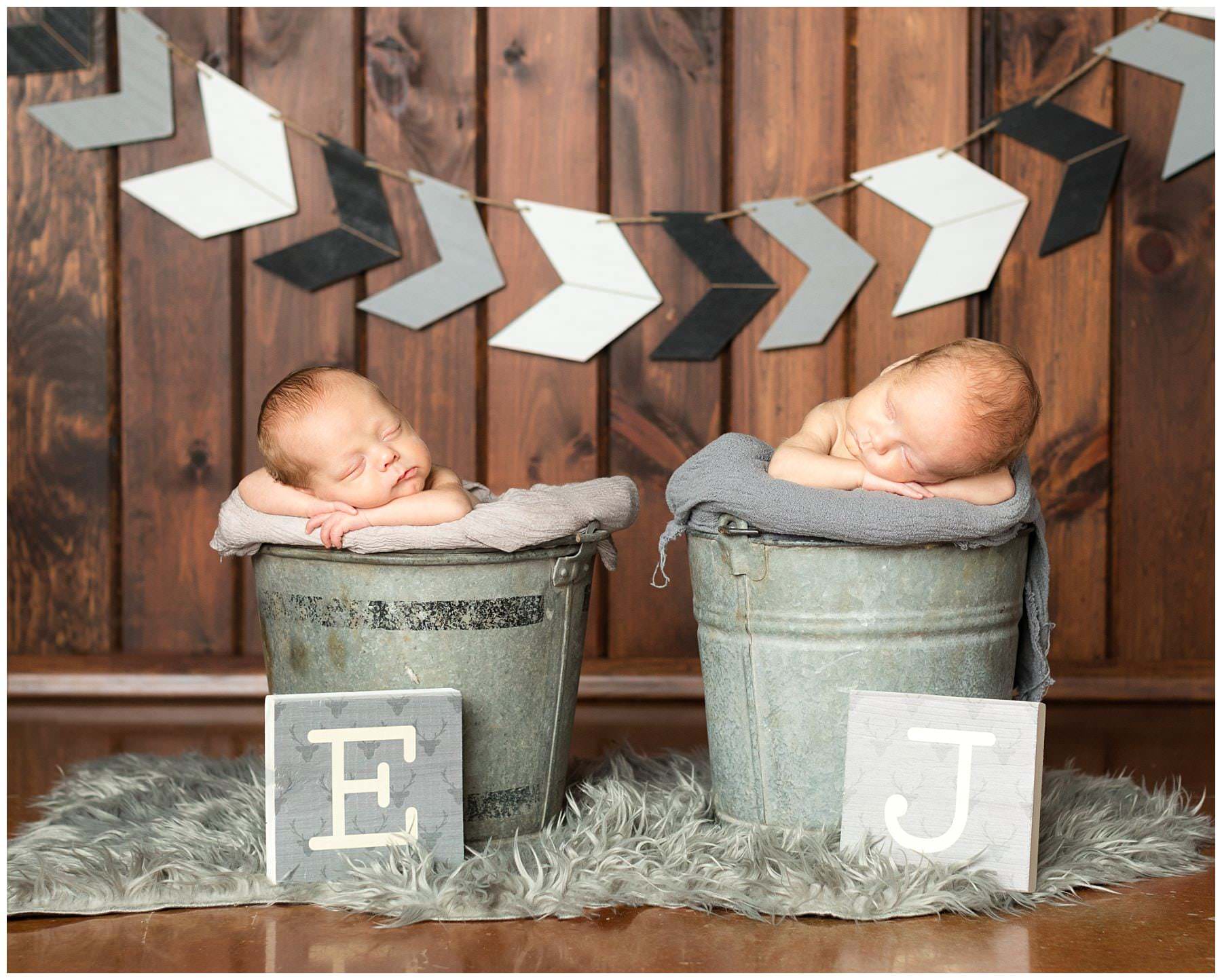 newborn twins in industrial buckets