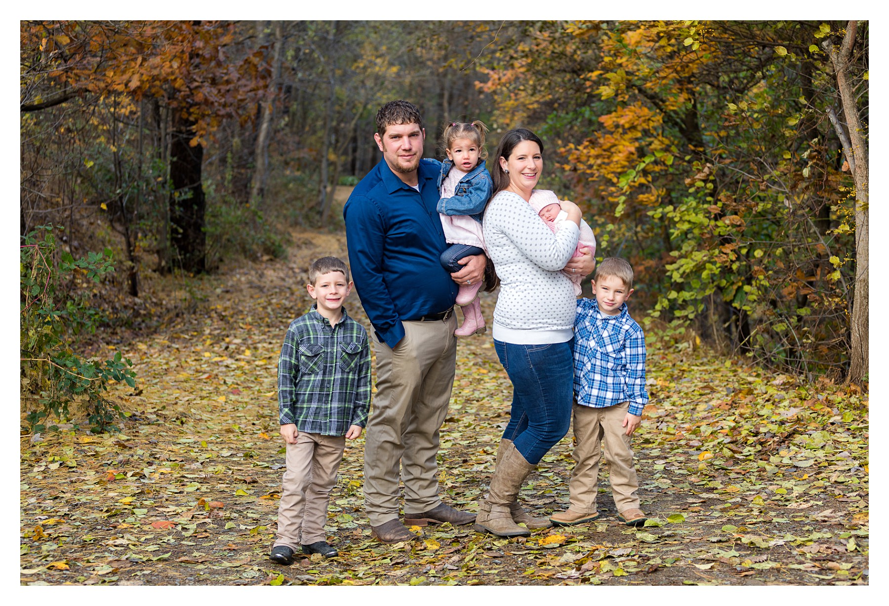 family photo outdoors with newborn in fall