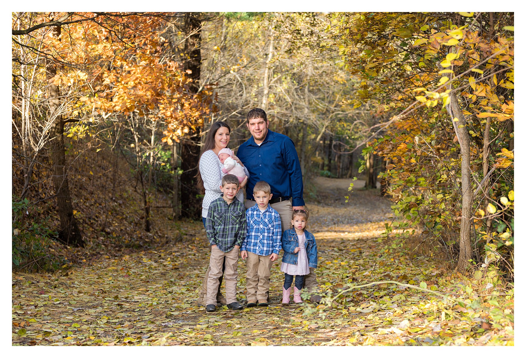 family photo outdoors with newborn in fall