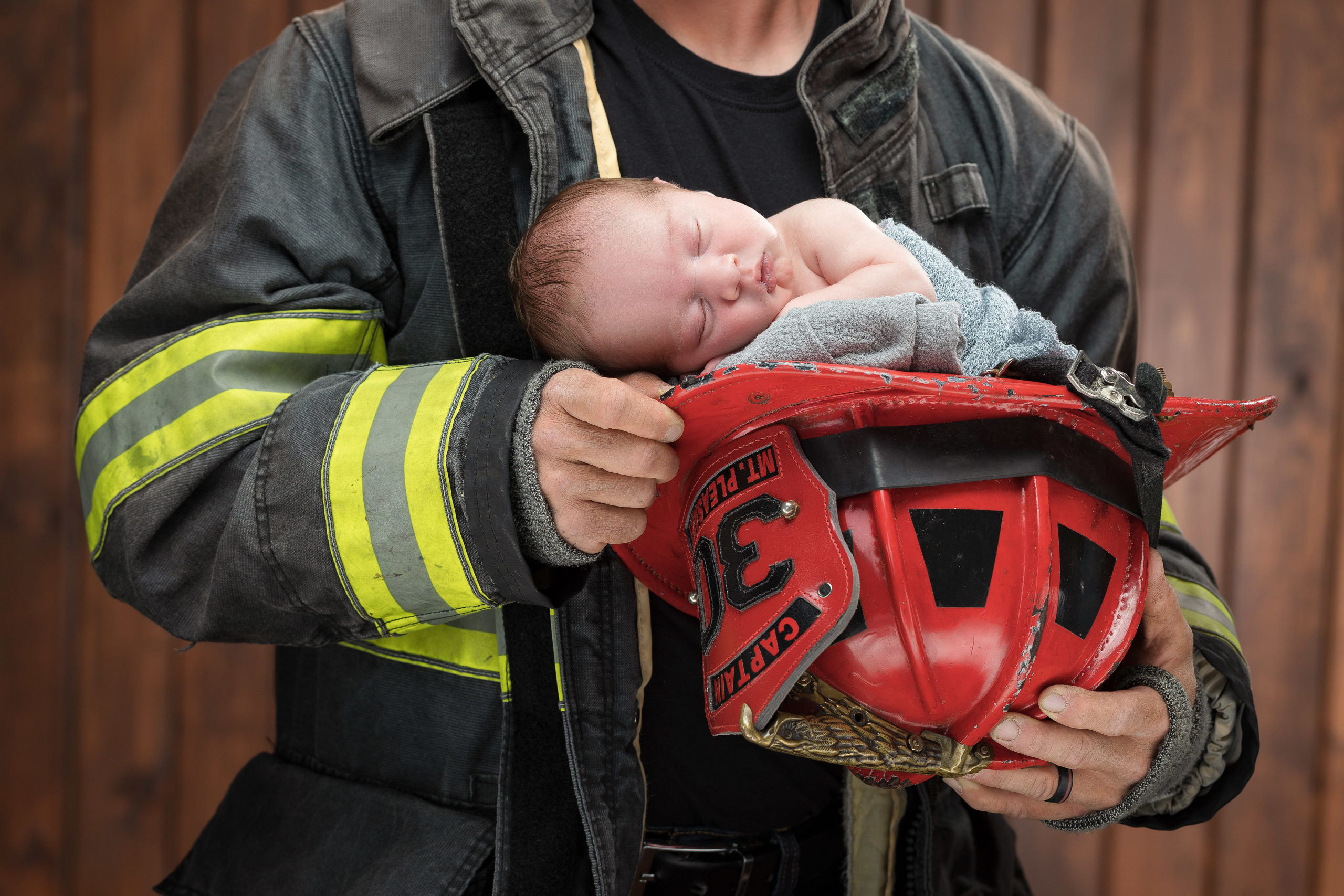 newborn studio photography fireman hat