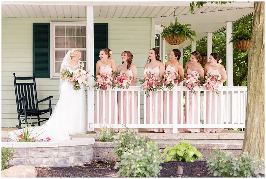 bridesmaids peeking at bride