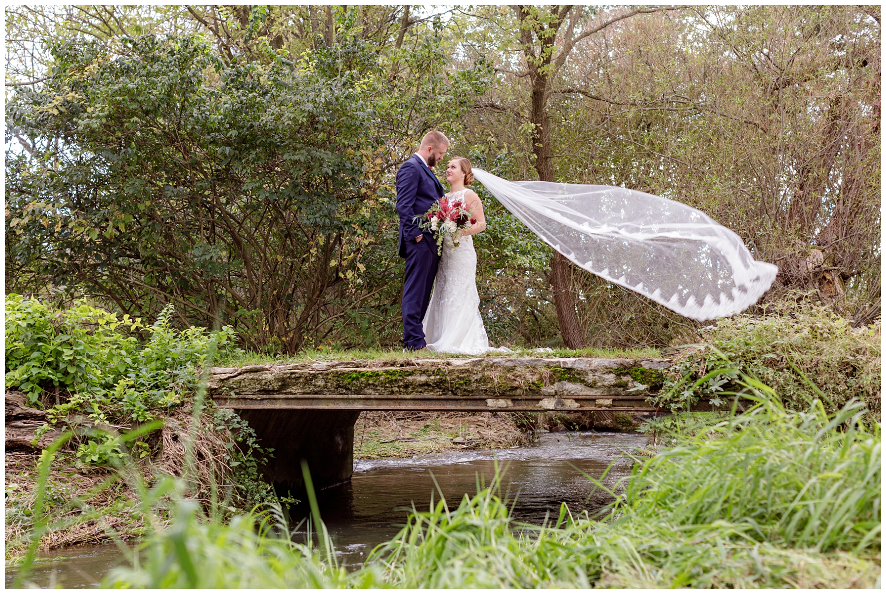 bride and groom on bridge photos
