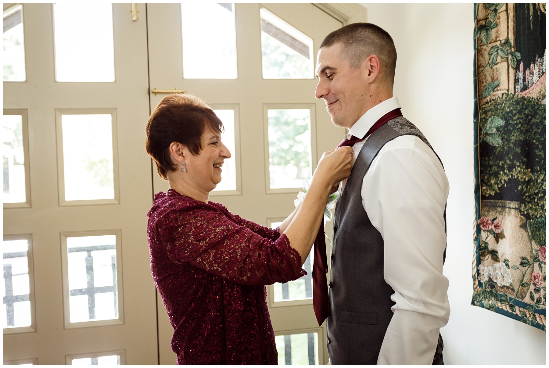 mom asissting groom pre-wedding